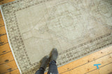 Distressed vintage Oushak runner with muted geometric border and minimalist medallion.