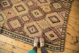 Time-softened diamond panel medallions on a hand-woven vintage Turkish Kilim rug.