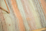 Vintage Turkish Blanched Kilim rug detail showing hand woven texture, muted stripes, and subtle tinting.