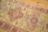 Geometric rams horn motifs on the low, even pile of a hand-knotted vintage runner.