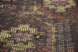 Detail of distressed vintage Jijim carpet with exposed foundation and multi-paneled weave.