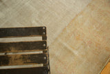 Distressed antique Oushak carpet detail, showing worn pile, knot heads, and pale gold ivory tones.