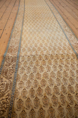 Repeating Mir cyprus tree pattern on vintage Tabriz runner, displaying beige, gold, and brown tones.
