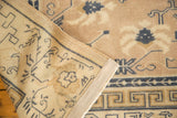 Distressed antique Chinese carpet with cobalt blue running T border and hand-knotted back.