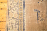 Distressed Chinese rug border, cobalt blue running T motif, beige field and plant.