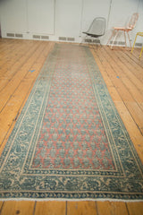 Textured distressed blush Tabriz runner with blue Serbend border and Mir cyprus motif.
