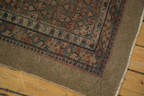 Evenly worn pile and secured selvedge of a camel hair Serab runner with detailed geometric borders.