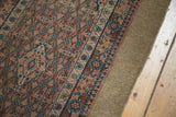 Detailed geometric borders and even pile wear on an antique Persian camel hair Serab runner.