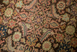 Vintage Malayer rug close-up, Herati motif on charcoal brown, featuring blush, mauve, ivory.
