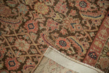 Vintage Malayer runner's detailed Herati motif in blush, bronze, and ivory, showing hand-knotted foundation.