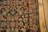 Detail of Vintage Malayer runner's secured edge, showing multi-toned barber pole border and Herati motif.
