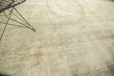 Textured vintage distressed Sparta carpet showing exposed foundation and muted floral tendrils.