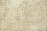 Distressed vintage Sparta carpet texture with pale green and ivory floral tendrils.