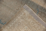 Distressed Sivas carpet pile showing wear, revealing hand-knotted foundation and neutral tones.
