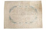 Vintage distressed Meshed carpet, ivory field with blue roundel medallion and floral vines.