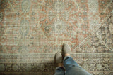 Distressed vintage Mahal carpet with worn, allover terracotta, pale sage, and charcoal patterns.