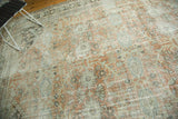 Distressed allover pattern in muted terra cotta, sage, and charcoal tones on a vintage Mahal carpet.