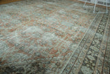 Distressed Mahal rug field with implied shadow medallions, worn terra cotta, sage, and charcoal border.