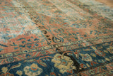Antique Lilihan carpet showing oxidized blush field, teal designs, indigo border, and etched texture.