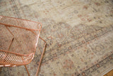 Distressed vintage Sparta carpet with faded floral vinery, pale rose, and visible foundation.
