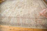 Distressed vintage Sparta carpet corner with time-softened floral patterns and even wear.