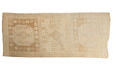 Vintage Distressed Oushak Runner with oversize triple medallions in neutral beige tones.