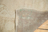 Robust hand-knotted weave on the back, revealing the distressed beige Oushak pile.