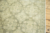 Sea foam green lattice design, clear outer border, and fringe of vintage distressed Oushak carpet.