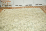 Distressed vintage Oushak rug with repeating sea foam green and oxidized silver lattice pattern.