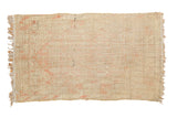 Vintage Distressed Tulu rug's hand-knotted beige foundation with blush patterns and tattered edges, 3'2