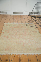 Vintage distressed Tulu rug showing light tatter to one end and low pile.