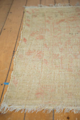 Distressed Tulu rug with low pile, visible foundation, and tattered fringe.