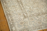 Vintage Distressed Oushak rug corner, soft cintimani design field and border in pale beige, ivory, silver, charcoal.