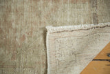 Vintage Distressed Oushak rug pile revealing foundation, fringe, and muted blush, ivory tones.