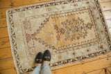 Vintage Prayer Oushak rug with germinating tree of life motif, starburst blossoms, faded gold and pale beige.