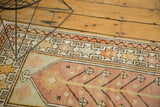 Blush vintage Oushak rug corner featuring saffron tree of life motifs and a starburst border.