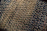 Distressed vintage Turkish Sparta carpet with repeating boteh pattern and heavy abrash.
