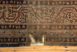 Distressed Sparta carpet with prominent foundation wear and custom edge detail.
