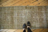 Distressed vintage Malayer runner, showing bronze, moss, and ivory Herati pattern.