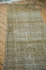 Subtle Herati motif through distressed pile of vintage Malayer runner, bronze and ivory.