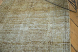 Distressed vintage Malayer rug pile, bronze and moss, showing even wear.