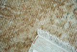 Textured distressed hand-knotted Malayer rug, showing worn pile, exposed foundation, and fringe.