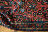 Vibrant madder red Lilihan runner with splayed floral motifs and deep blue border.