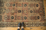 Vintage Oushak rug featuring vertical medallion columns in rich copper, beige, and chocolate brown.
