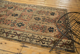 Hand-knotted vintage Oushak rug showcasing geometric motifs in copper, beige, and dark brown.
