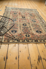 Vintage Oushak rug corner: geometric patterns in copper, beige, chocolate brown, secured edge.