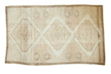 Hand knotted Distressed Oushak carpet, ivory and beige, with three large diamond medallions.