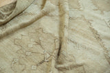 Textured vintage Distressed Oushak Carpet, showing even wear and subtle ivory and beige patterns.