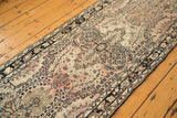 Traditional Lilihan runner detail with repeating floral spray motif in dusty rose, ivory, and navy.