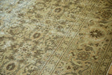 Aged textured Sivas rug with Herati design, lotus palmette border, beige tones.